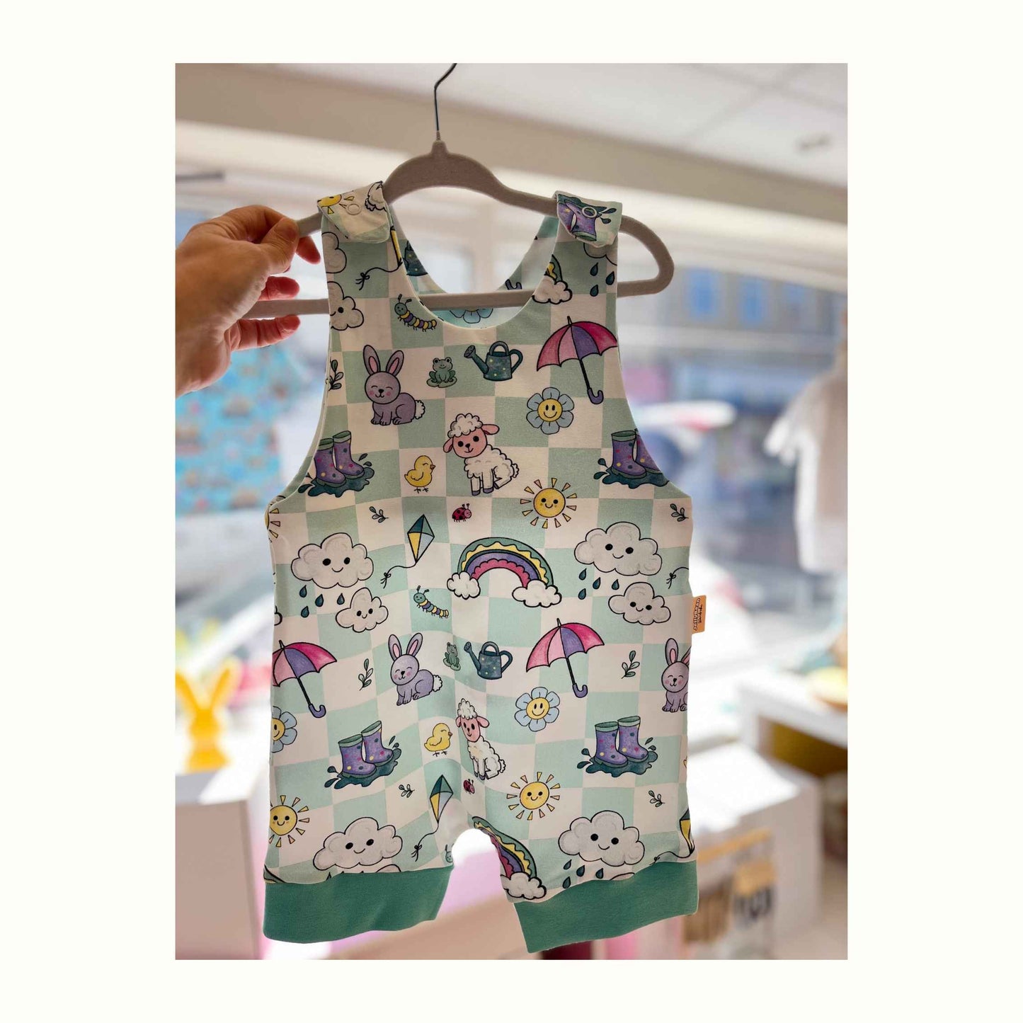 checked background featuring spring animals sunshine and rainbows handmade short spring summer romper