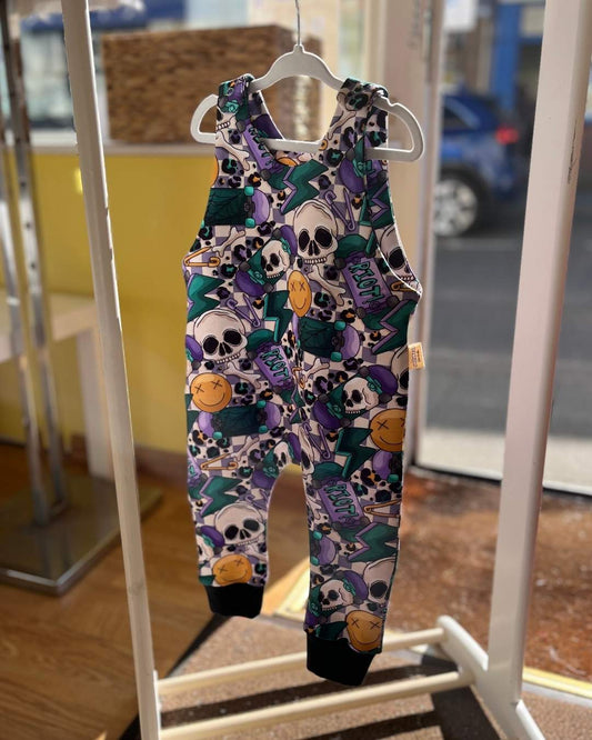 PURPLE CHECK BACKGROUND FEATURING SKATERS AND SKULLS PATTERN BABY AND TODDLER ROMPER 