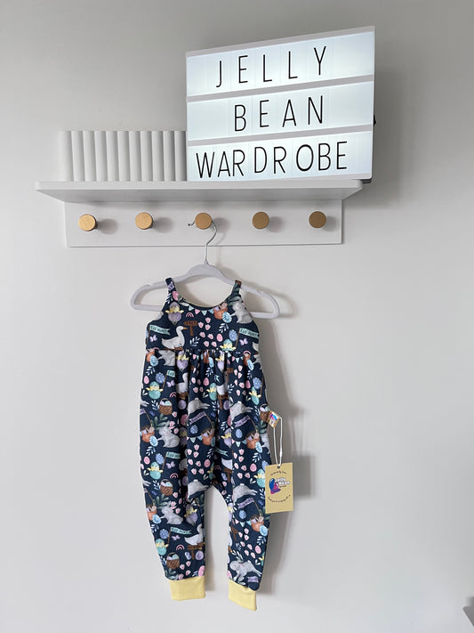 Easter animals on an easter egg hunt on a navy blue background romper