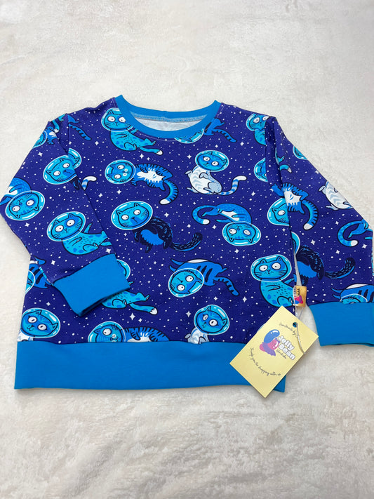 Bold blue background, Blue cats in space 