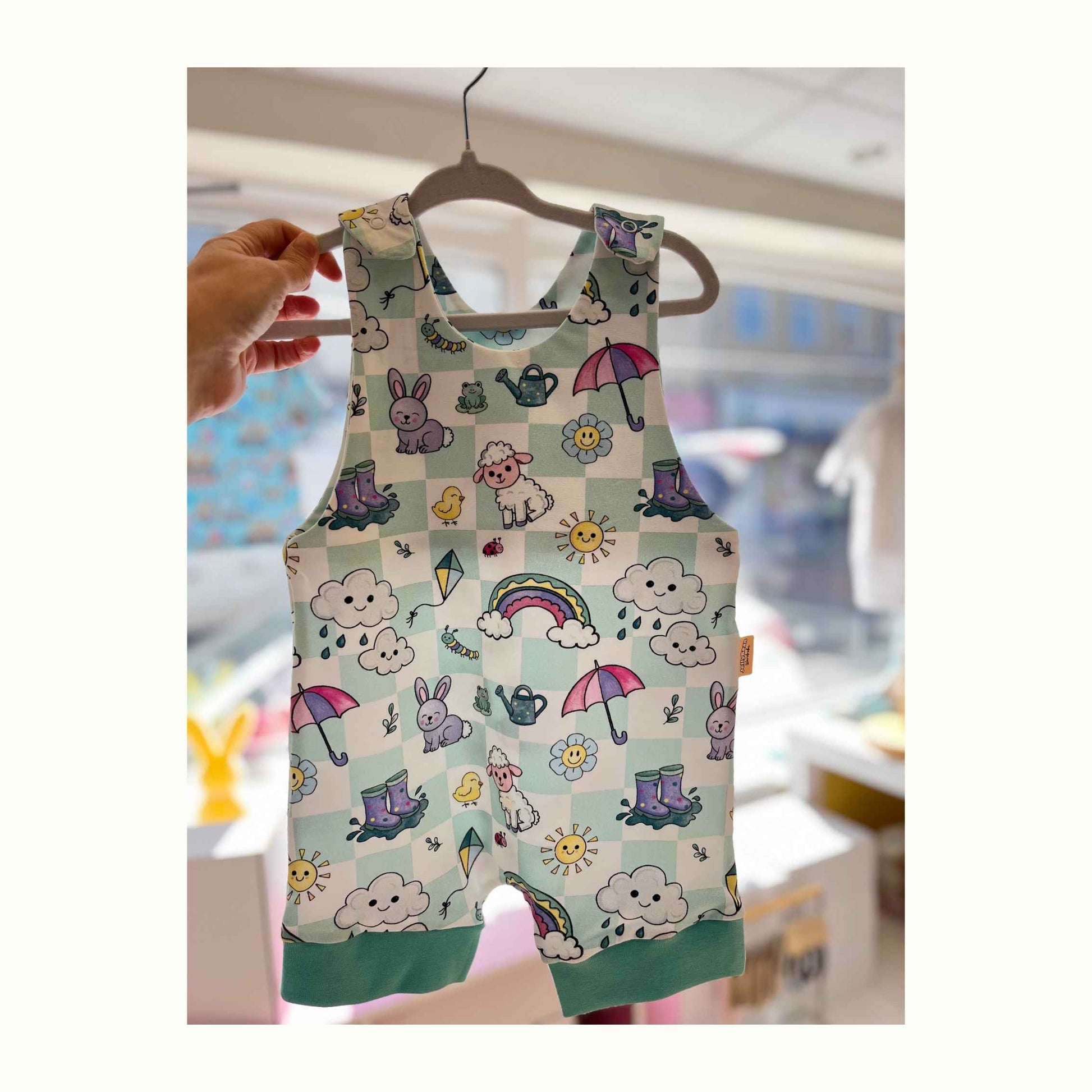 checked background featuring spring animals sunshine and rainbows handmade short spring summer romper 